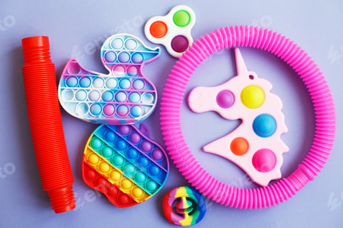 Preview: colorful antistress sensory fidget toys on a blue background