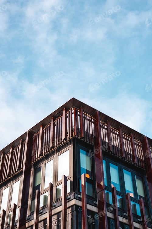 Preview: Modern architectural building under blue sky.