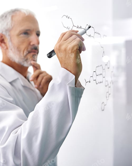 Preview: Shot of a mature male scientist drawing a molecular structure on a glass surface