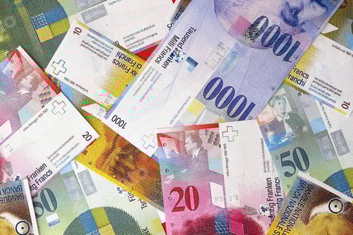 Preview: Swiss franc banknotes. The current francs money bills lies on table in big amount