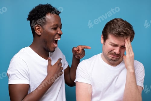 Preview: African man laughs at his friend. He won the argument or competition.