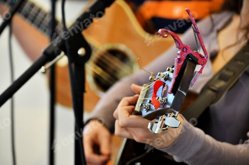 Preview: Live music at a festival - Female Playing her guitar while singing. Performing music live on stage.