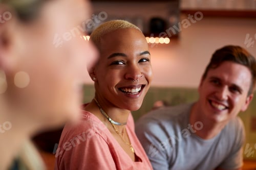 Preview: Group Of Friends Meeting At Home Having Fun Socializing Together