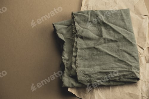 Preview: top view green textile on a brown background