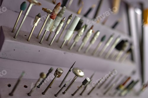 Preview: Displaying Various Dental Tools and Equipment on Rack