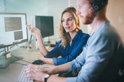 Preview: Programmers cooperating at information technology company