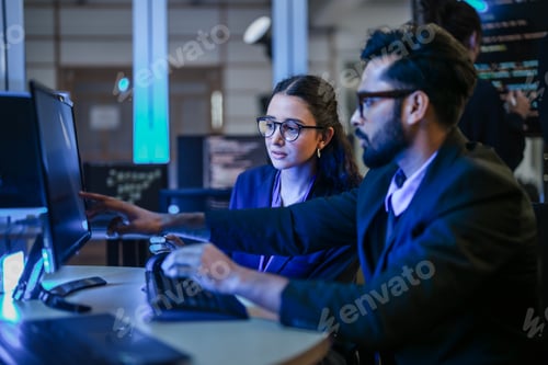 Preview: diverse team of AI developers shares a successful moment in the office.