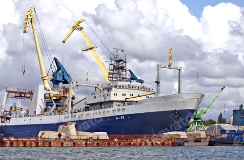 Preview: Cargo vessel standing at the trading seaport
