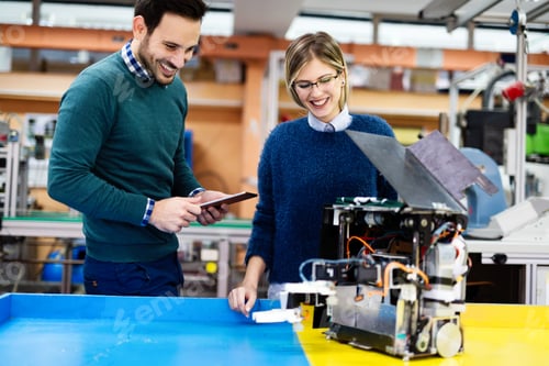 Preview: Young students of robotics working on project