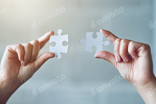 Preview: All the pieces are coming together. Cropped shot of a woman holding two puzzle pieces.