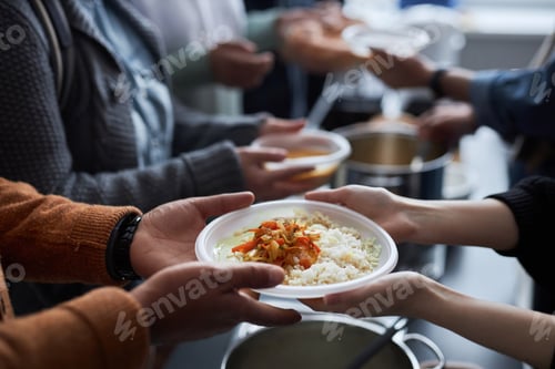 Preview: Volunteer Helping Refugees at Soup Kitchen