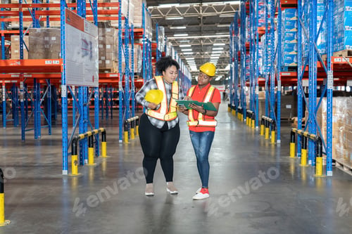 Preview: Diverse worker in warehouse hold check sheet looking storage scan location to keep and collect boxes