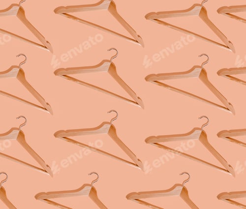Preview: Pattern hangers for clothes. Hanger set. Beige background copy space banner. Wooden hangers. Store