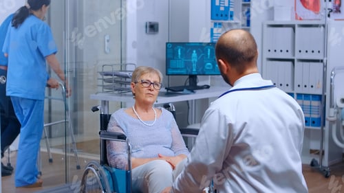 Preview: Elderly woman in wheelchair at doctor appointment