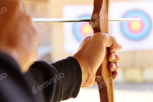 Preview: Archer holds his bow aiming at a target