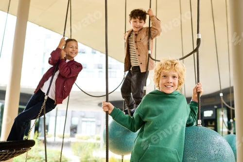 Preview: Children playing joyfully on a playground during a beautiful autumn day in the city