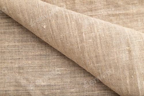 Preview: Fragment of rough linen tissue. Side view, natural textile background.