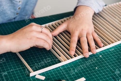 Preview: Woman architecture student working on models