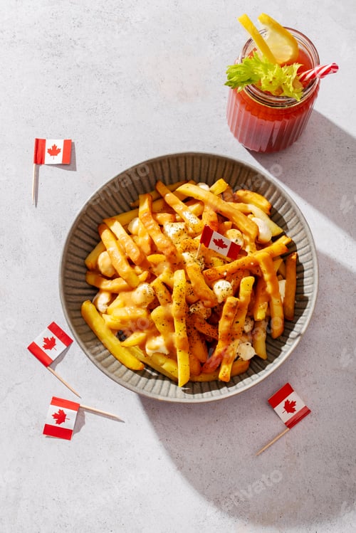Preview: Canadian poutine with fries, cheese curds, and gravy, decorated with Canadian flags
