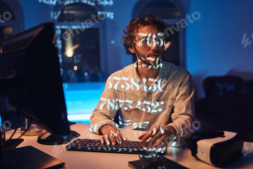 Preview: Serious office worker looks at camera typing on computer keyboard