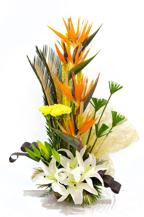 Preview: some flowers and grass are arranged in a glass container with ribbons