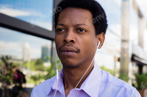 Preview: Portrait of an handsome businessman outdoor.