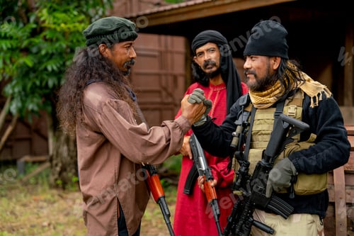 Preview: Close up group of men with soldier and arab clothes stand with holding hand look like join for fight