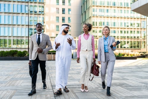 Preview: Group of multiethnic business people meeting an emirati businessman
