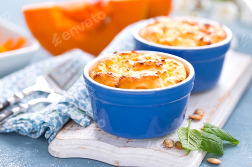Preview: Delicious mini casserole with cottage cheese and pumpkin for breakfast. White background. Closeup
