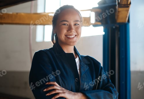 Preview: Shot of a female mechanic posing with her arms crossed in an auto repair shop