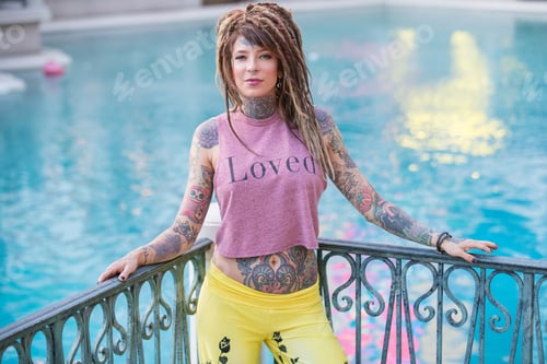 Preview: Beautiful hippie woman with tattoos and dreadlocks