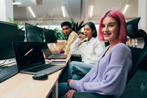 Preview: young programmers working on a new project for a start up business.