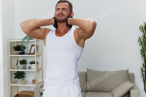 Preview: Man sports neck pain, workout injury at home, pumped up man fitness trainer works out at home