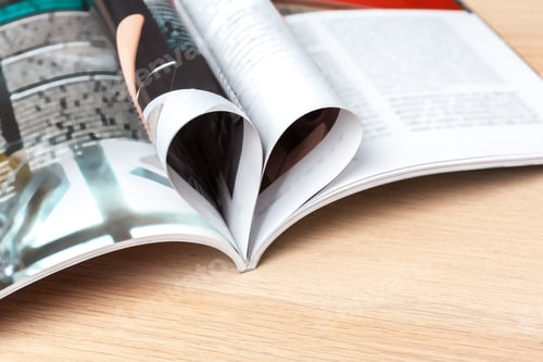Preview: Pages of book curved into a heart shape, close up