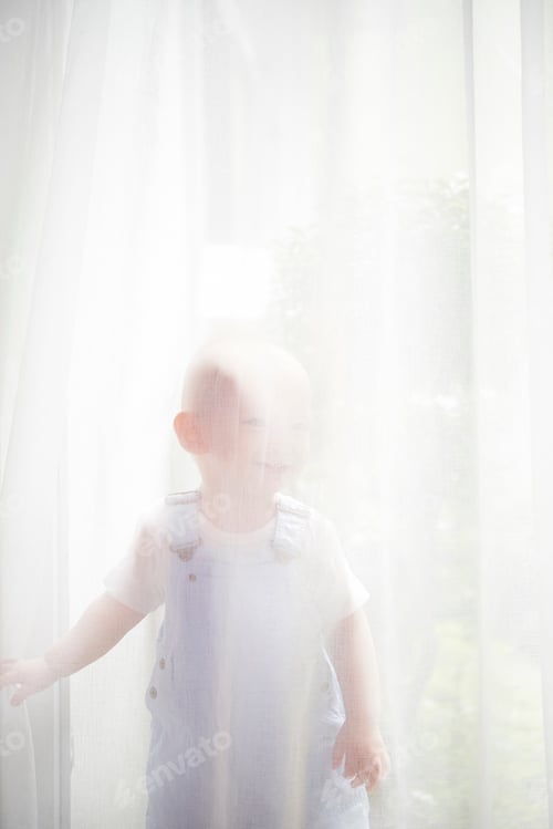 Preview: Kid standing behind curtain