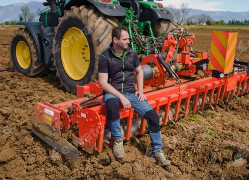 Preview: A skilled farmer proudly stands next to his plowing tractor, demonstrating his expertise in field