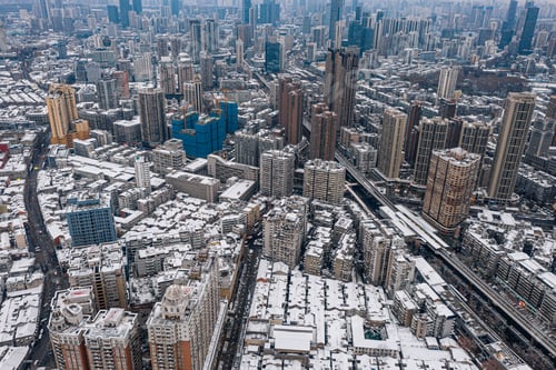 Preview: Aerial shot of buildings covered in snow in Wuhan, China.
