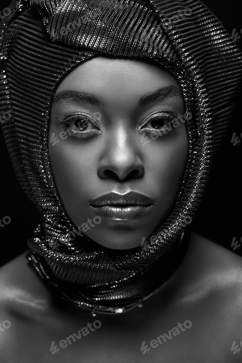 Preview: black and white photo of stylish african american woman looking at camera isolated on black