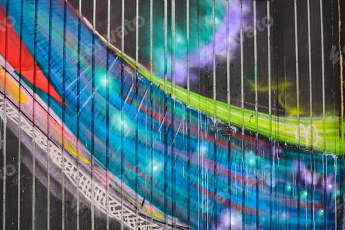 Preview: Detail of an anonymous street graffiti with many colors, cheerful urban background.
