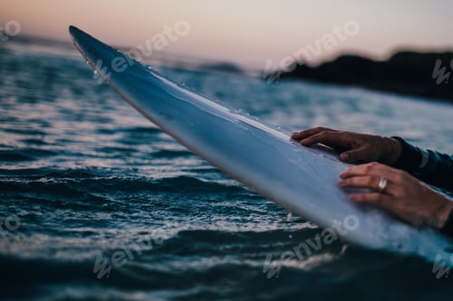 Serene Ocean Surfboard Ride at Sunrise