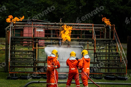 Preview: Firefighter Concept. Fireman using water and extinguisher to fighting with fire flame.