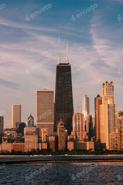 Preview: Vertical shot of modern skyscrapers and buildings in downtown Chicago at sunset