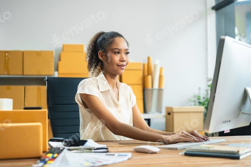 Preview: small business entrepreneur SME or freelance asian woman working with box at home.