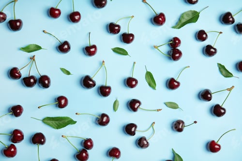 Preview: Flat lay composition with sweet red cherries on color background