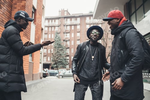 Preview: three african men greeting in the street