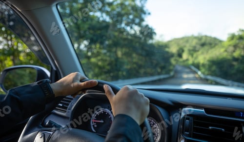 Preview: People driving car on mountain road