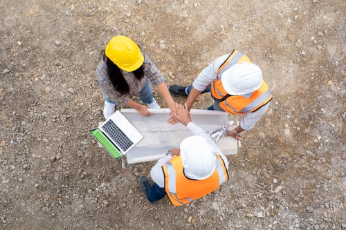 Preview: Architect,Foreman and worker discussing in building construction site.