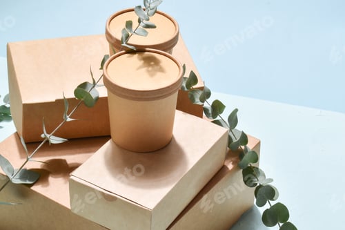 Preview: A pile of paper packaging on a neutral background. Food delivery, takeaway.