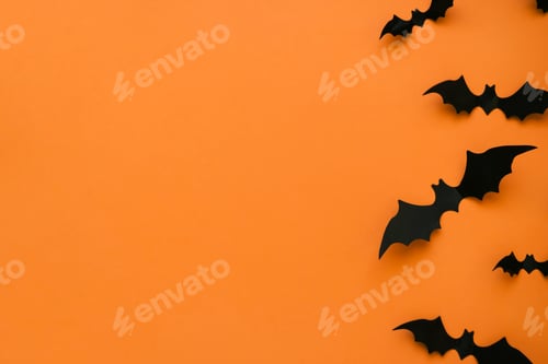 Preview: Bright orange background with black bats and place for text.