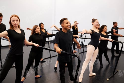 Preview: Male And Female Students At Performing Arts School Rehearsing Ballet In Dance Studio Using Barre